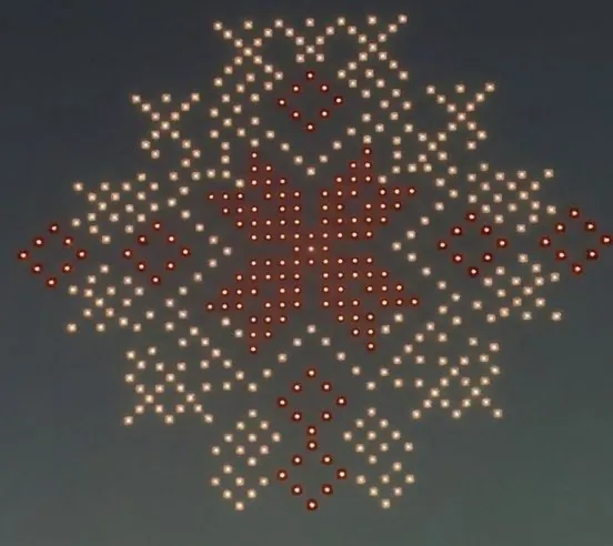 Drone light show forming a red geometric pattern